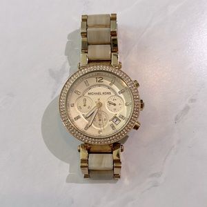 Michael kors gold and white tortoise watch.